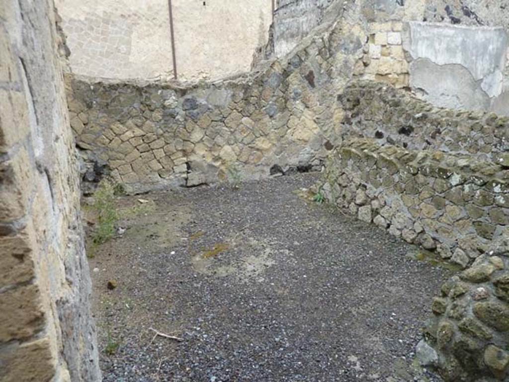 IV.8, Herculaneum, September 2015. Room 3, looking towards north wall, and with separate area or small room, on right. According to Pesando and Guidobaldi, in the north-west corner would have been the channel for the discharge pipe from the latrine above on the upper floor.